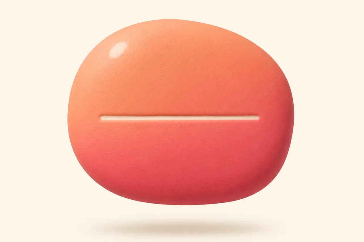 A single smooth clay pebble with one short line incised across its face
