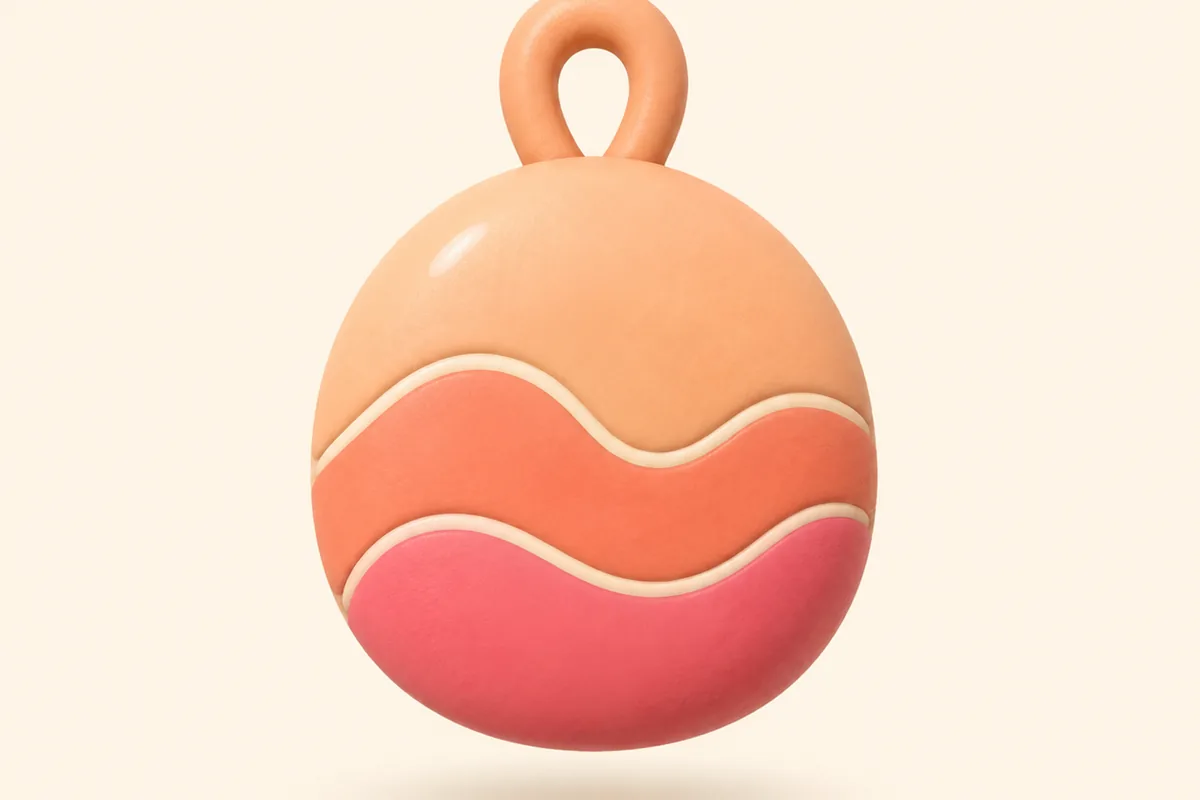 A single round clay pebble banded in peach, coral and rose, with a small loop rising from the top of it